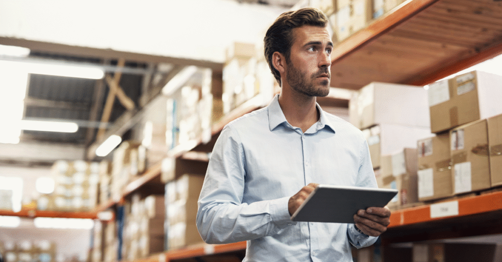 Shot of a young man using a digital tablet while working in a warehouse 2