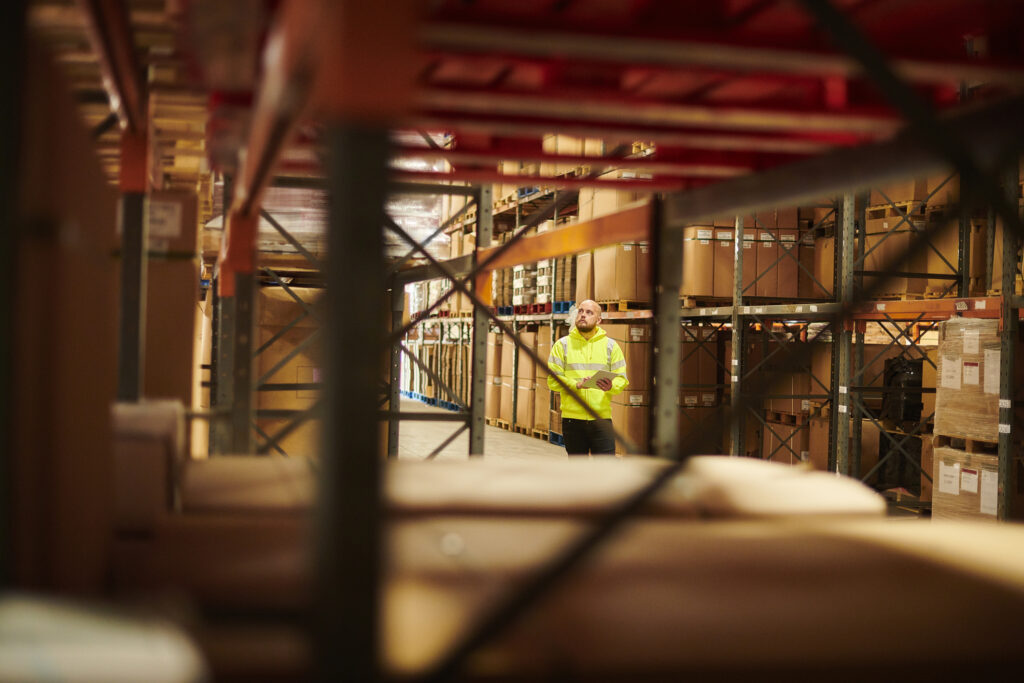 Worker reviewing 3PL billing and warehouse operations to prevent revenue leakage and improve billing accuracy.