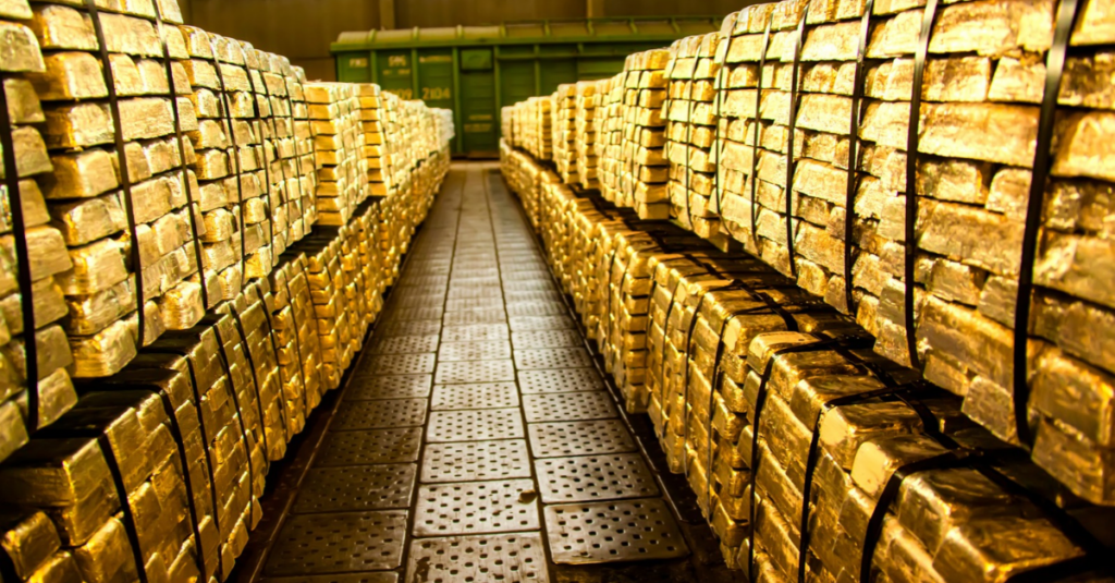 Rows of stacked gold bars secured with bands inside precious metals storage facility