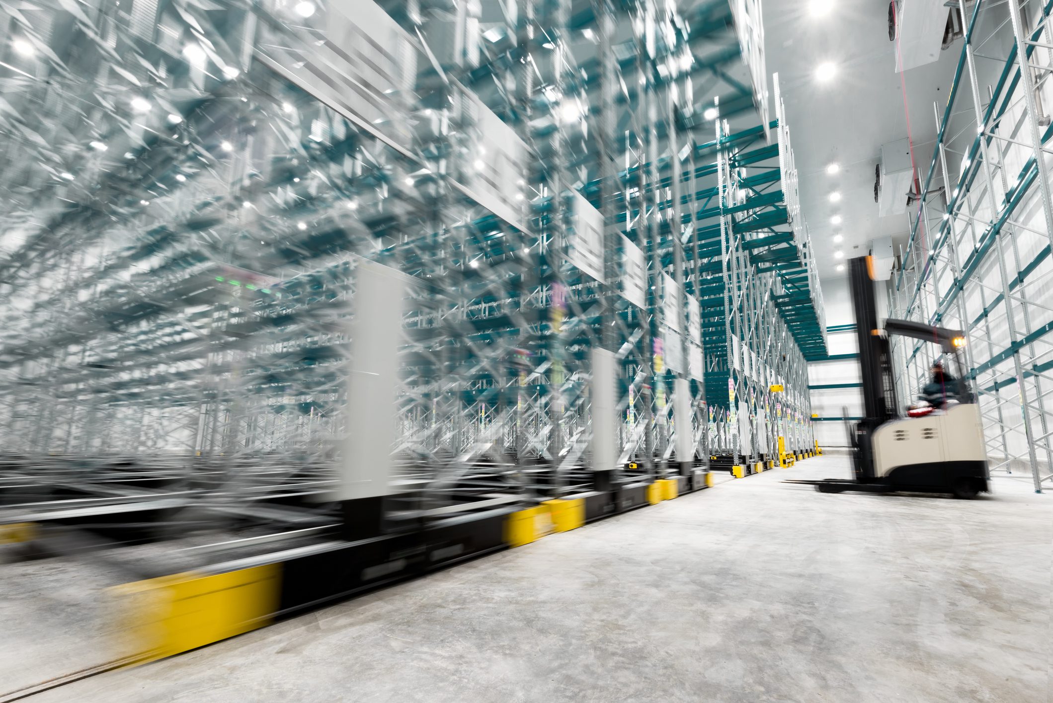 New cold room storage. Refrigeration and freezing warehouse with stacker truck inside moving. cold storage room